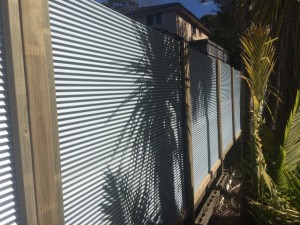 Corrugated metal fence